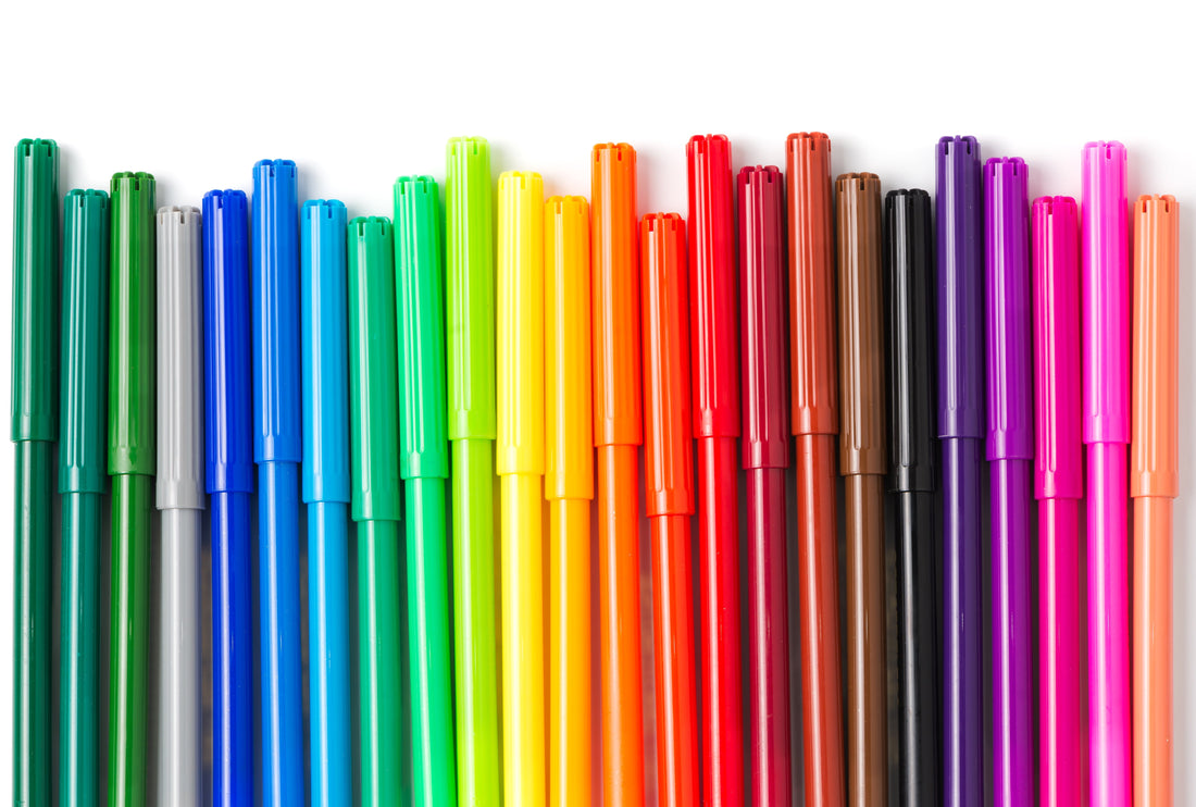 Thin markers next to each other sorted by rainbow