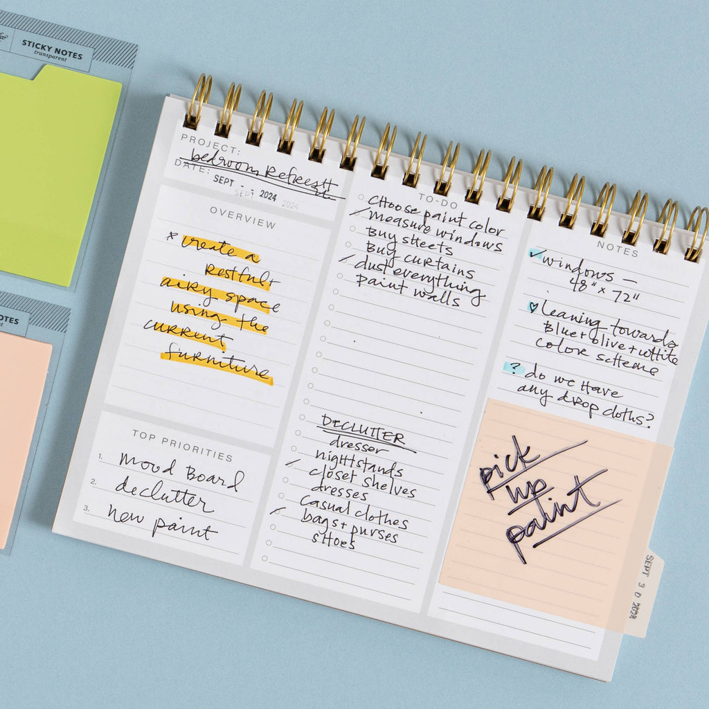 Notebook with handwritten notes on a light blue background